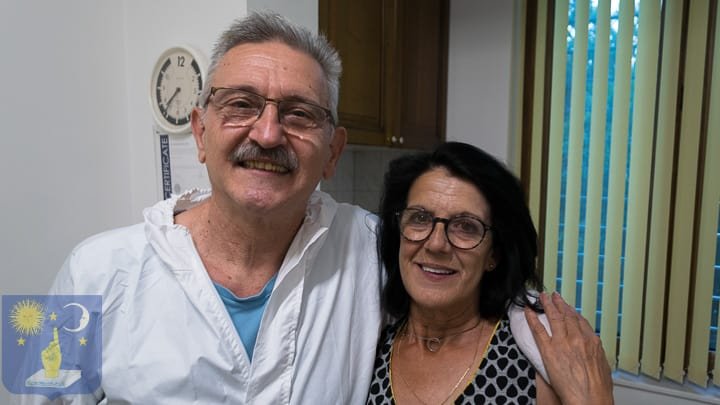 Dr Genchev with patient after dental restoration for gum disease