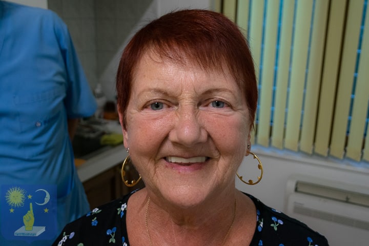 Dr Genchev with patient smoker after restoration full dental restoration